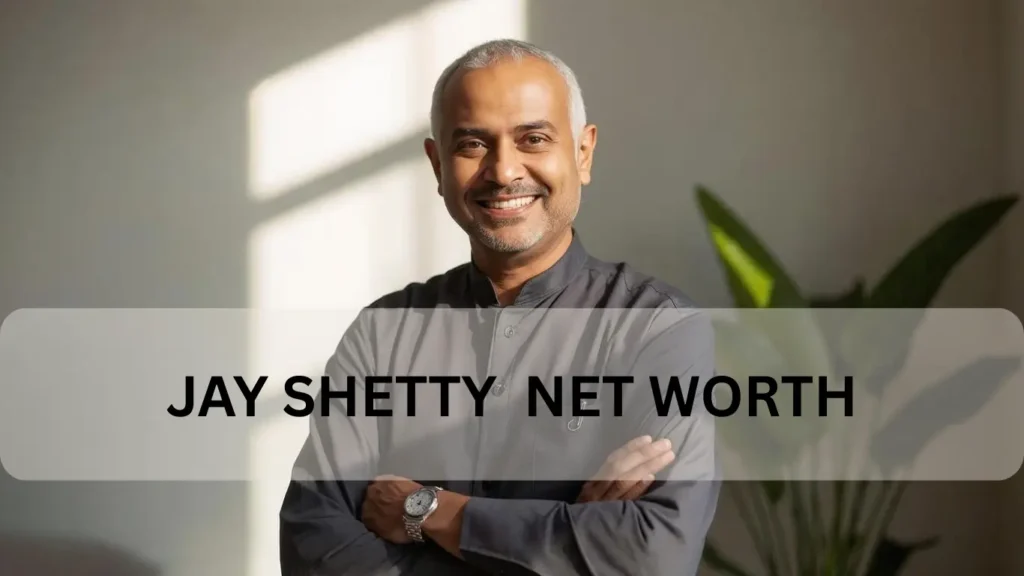 Jay Shetty net worth portrait in olive jacket